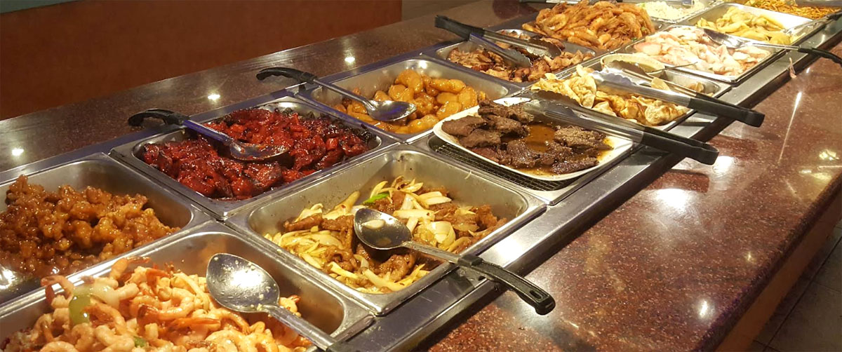 All-you-can-eat buffet line with shrimp, beef, chicken and noodles